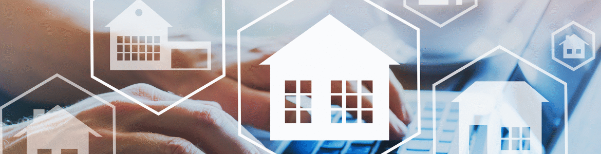 White house icons inside hexagons overlay a blurred background of hands typing on a keyboard, symbolizing real estate tech.